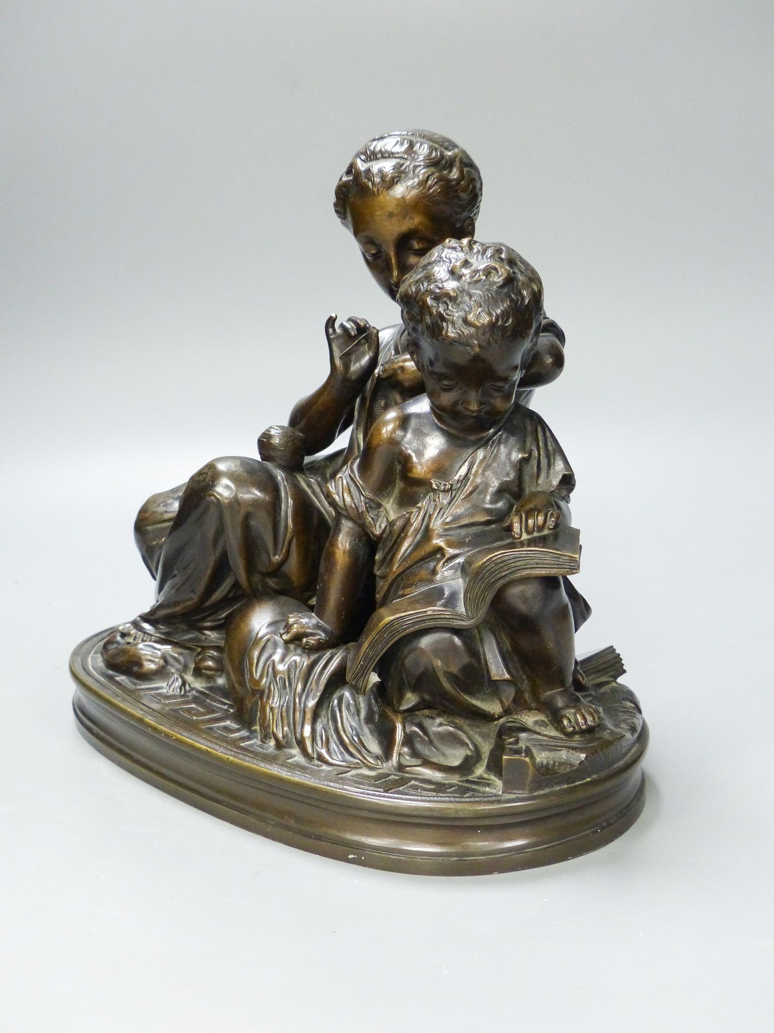 A 19th century bronze figure group of a mother and child 25cm